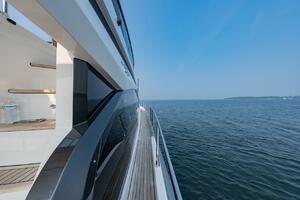 2023 Azimut Fly 53 yacht cruising on open water under clear 
