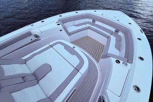 Luxurious seating area on 2024 Scout 400 LXF boat, featuring elegant design and spacious layout.