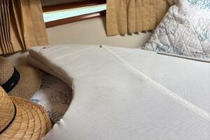 Interior of 2006 Carver 43 Motor Yacht with bed, pillows, an