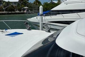 2006 Carver 43 Motor Yacht docked in sunny marina with palm 