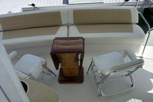 2006 Carver 43 Motor Yacht deck with seating and table, dock