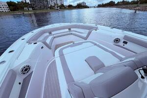 2024 Scout 400 LXF boat interior with luxurious seating on a calm waterway.