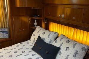 Luxurious bedroom interior of 2006 Carver 43 Motor Yacht wit