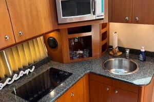 2006 Carver 43 Motor Yacht kitchen with microwave, sink, and