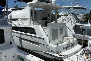 2006 Carver 43 Motor Yacht docked at marina under clear blue