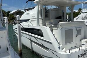 2006 Carver 43 Motor Yacht docked at marina under clear blue