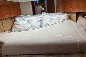 Interior of 2006 Carver 43 Motor Yacht with cozy bed and por