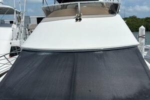 2006 Carver 43 Motor Yacht with black sunshade, docked under