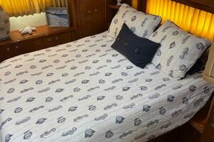 Cozy bedroom in 2006 Carver 43 Motor Yacht with nautical-the