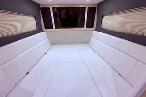 Luxurious interior cabin of 2024 Scout 400 LXF with white seating and modern design.