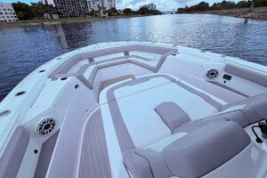 2024 Scout 400 LXF boat interior with luxurious seating on a calm waterway.