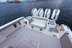 2024 Scout 400 LXF boat deck with seating and multiple Mercury engines.
