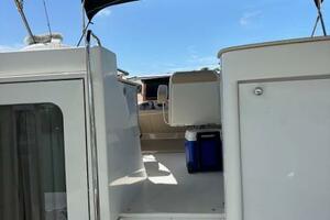 2006 Carver 43 Motor Yacht with open deck and canopy under c