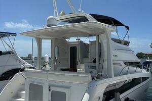 2006 Carver 43 Motor Yacht docked under clear blue sky.