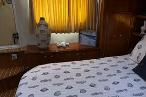 Cozy bedroom interior of 2006 Carver 43 Motor Yacht with nau