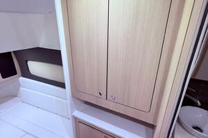 2024 Scout 400 LXF cabin interior with wood cabinetry and seating area.