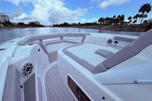 Luxurious 2024 Scout 400 LXF boat interior with plush seating and scenic waterway view.