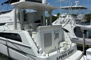 2006 Carver 43 Motor Yacht docked at marina under clear blue