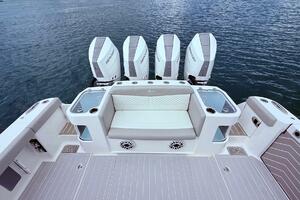 2024 Scout 400 LXF boat with four Mercury engines on the water.