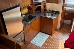 Interior of 2006 Carver 43 Motor Yacht with kitchen and wood