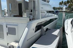 2006 Carver 43 Motor Yacht docked at marina, sunny day, clea