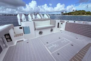 2024 Scout 400 LXF boat deck with seating, ocean view, and clear skies.