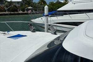 2006 Carver 43 Motor Yacht docked in a sunny marina setting.