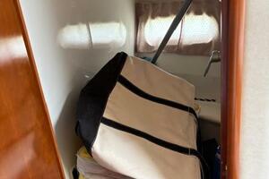 Storage area inside 2006 Carver 43 Motor Yacht with bags and