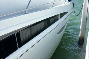 2006 Carver 43 Motor Yacht docked in sunny marina, side view