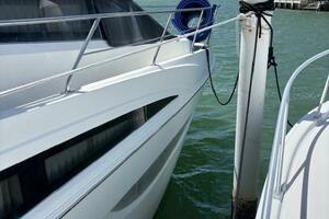 2006 Carver 43 Motor Yacht docked, sunny day, calm waters, b
