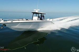 2022 CG Boat Works 35 M-Series speeding on calm water.