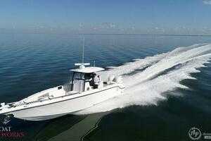 A 2022 CG Boat Works 35 M-Series cruising on calm waters.