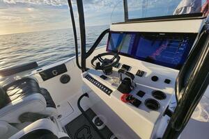 2022 CG Boat Works 35 M-Series cockpit with modern navigation system at sea.