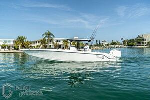 2022 CG Boat Works 35 M-Series cruising on a sunny waterfront.