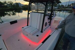 2022 CG Boat Works 35 M-Series with illuminated seating and console at sunset.