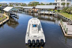 2015 Yellowfin 39 boat docked in a scenic waterfront marina 