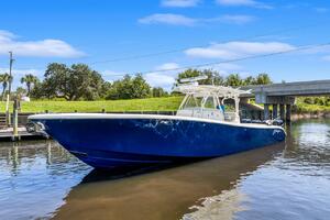 2015 Yellowfin 39 boat on calm water under blue sky.