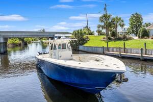 2015 Yellowfin 39 boat on a scenic canal with blue skies.