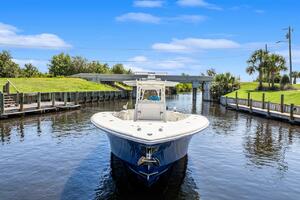 2015 Yellowfin 39 boat navigating a calm canal under a clear