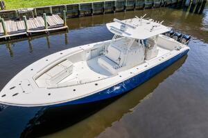 2015 Yellowfin 39 boat docked on calm water, featuring sleek