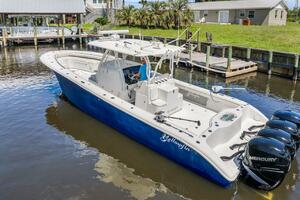 2015 Yellowfin 39 boat with Mercury engines docked in a sere