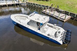 2015 Yellowfin 39 boat with quad Mercury engines docked in a