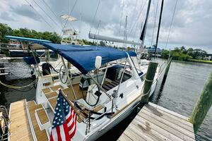 2015 Beneteau Oceanis 45 sailboat docked, featuring blue can
