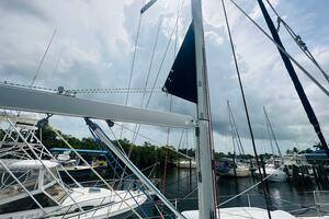 Beneteau Oceanis 45 sailboat docked at marina, cloudy sky, 2
