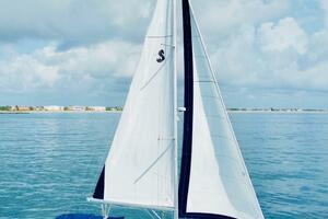 2015 Beneteau Oceanis 45 sailing on calm blue waters under a