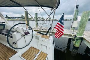 Beneteau Oceanis 45 sailboat cockpit with American flag, doc
