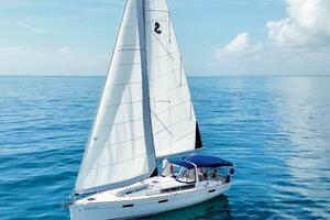 Beneteau Oceanis 45 sailboat from 2015 on calm blue ocean un