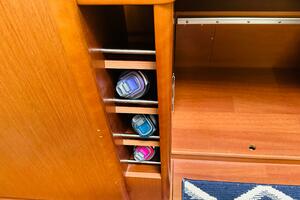 Wooden interior storage with water bottles on a 2015 Benetea
