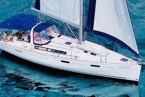 2015 Beneteau Oceanis 45 sailboat cruising on clear blue wat
