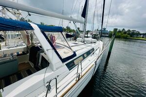 2015 Beneteau Oceanis 45 sailboat docked on a calm waterway 